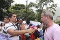 Anti Nicolas Maduro protesters is interviewed during a massive demonstration against the dictatorshi Royalty Free Stock Photo