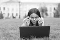 anti-reflective coating glasses. online education. back to school. teen girl use computer in park. child in glasses with Royalty Free Stock Photo