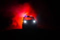 Anti-riot police give signal to be ready. Government power concept. Police in action. Smoke on a dark background with lights. Blue