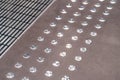 Anti slip round metal buttons on floor Royalty Free Stock Photo