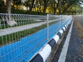 Anti snatch thief fencing is installed on sidewalks to prevent snatch theft. Royalty Free Stock Photo