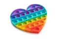 Anti stress rainbow pop it fidget toy in the shape of a heart isolated on a white background Royalty Free Stock Photo