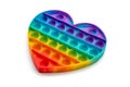 Anti stress rainbow pop it fidget toy in the shape of a heart isolated on a white background. Royalty Free Stock Photo