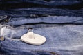 Anti-theft device used in commerce, tag or anti-theft tag on denim clothing Royalty Free Stock Photo