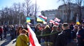 Anti-war protest outside Russian embassy in Warsaw. Demonstrators call for peace and condemn Putin.