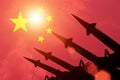 Antiaircraft rockets silhouettes on background of China flag. Royalty Free Stock Photo