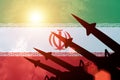 Antiaircraft rockets silhouettes on background of Iran flag.