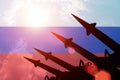 Antiaircraft rockets silhouettes on background of Russia flag.