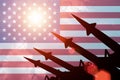 Antiaircraft rockets silhouettes on background of USA flag