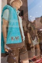 Male mannequin in shop window wearing garment embroidered with word Kiwi and Saint Tropez