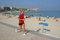 Jogging girl in red polo shirt