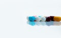 Antibiotic capsule pills on white background. Prescription drugs. Colorful capsule pills. Antibiotic drug resistance concept.