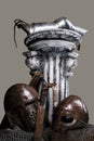 Antic column with sword and helmets