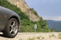 Anticline geological feature with front of Mazda MX5 in foreground. Royalty Free Stock Photo