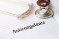 ANTICOAGULANT. Text on a medical card next to a pen stethoscope Royalty Free Stock Photo