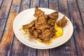 Anticuchos punctured on toothpicks cooked on the grill with boiled potatoes and cooked white corn Royalty Free Stock Photo