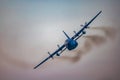 Antidotum Airshow Leszno 2023 and acrobatic shows full of smoke of C-130 Hercules plane on a cloudy