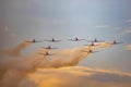 Antidotum Airshow Leszno 2023 and acrobatic shows full of smoke of PC-7 planes team on a cloudy sky Royalty Free Stock Photo