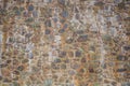 antient medieval cobblestones wall made of processed stones in cement Royalty Free Stock Photo