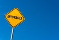 Antifragile - yellow sign with blue sky