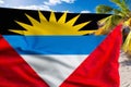 Antigua and Barbuda Flag on a Caribbean Beach Royalty Free Stock Photo