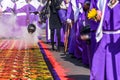 Burning incense in Good Friday procession beside dyed sawdust carpet, Antigua, Guatemala Royalty Free Stock Photo