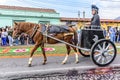 Roman chariot in Good Friday procession walks beside procession carpet, Antigua, Guatemala Royalty Free Stock Photo