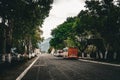 Antigua, Guatemala- May 22, 2023: Empty street in Antigua with cobblestone road and parked chicken buses