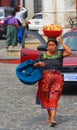 Portrait of a Mayan woman carring fruits on her head. Royalty Free Stock Photo