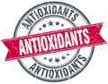 Antioxidants red round grunge vintage stamp Royalty Free Stock Photo