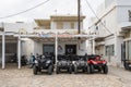 Quad bikes for rent are waiting for clients on street in Antiparos. Greece Royalty Free Stock Photo