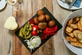 Antipasti Appetizer sweet cherry mini peppers stuffed with soft cheese feta and onions on slate plate Royalty Free Stock Photo