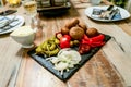 Antipasti Appetizer sweet cherry mini peppers stuffed with soft cheese feta and onions on slate plate Royalty Free Stock Photo