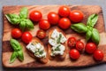 Antipasti bruschetta canape with tomatoes mozzarella basil on plate. Royalty Free Stock Photo