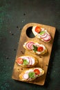 Antipasti snacks set for Wine. Brushetta or Crostini with Toasted Baguette, Cheese, Radish and Tomatoes served