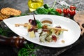 Antipasto Assorted cheeses: brie, parmesan, feta and blue cheese on a plate. Royalty Free Stock Photo