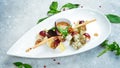 Antipasto Assorted cheeses: brie, parmesan, feta and blue cheese on a plate. Royalty Free Stock Photo