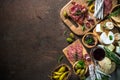 Antipasto delicatessen - meat, cheese, olives and wine on stone Royalty Free Stock Photo
