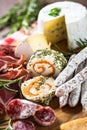 Antipasto delicatessen - meat, cheese, olives and wine on stone Royalty Free Stock Photo