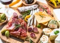 Antipasto delicatessen - meat, cheese and wine.