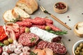 Antipasto meat board. catering platter with bacon, jamon, sausage and wine. Food recipe background. Close up Royalty Free Stock Photo