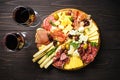 Antipasto platter with jamon, salammi and cheese assortment.