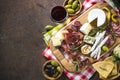 Antipasto - sliced meat, ham, salami, cheese, olives on wooden b Royalty Free Stock Photo