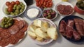 Antipasto table with salami, cheese, olives and bread