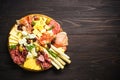 Antipasto platter with jamon, salammi and cheese assortment.