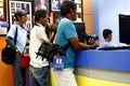 Photographers line up at a photo printing shop to have pictures printed