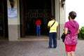 Catholic devotees pray outside a closed church during the Covid 19 virus outbreak