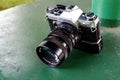 Old and vintage single lens reflex or SLR Canon AE-1 35mm film camera Royalty Free Stock Photo