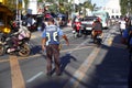 Traffic police officer manage the traffic along a busy road near the Antipolo Cathedral