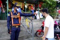 Security guard check temperature of customers at a public market during the Covid 19 virus outbreak